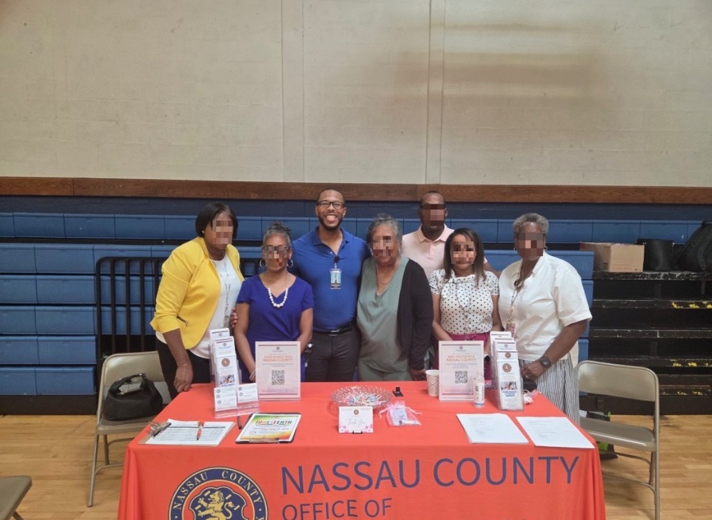 Dr. Jermaine Lee and partners at the Senior Wellness Workshop table for Operation Get Ahead